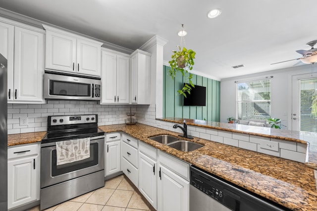 kitchen with sink, white cabinetry, and stainless steel appliances