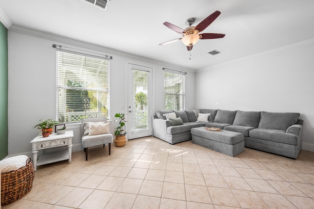 tiled living room with ceiling fan and ornamental molding