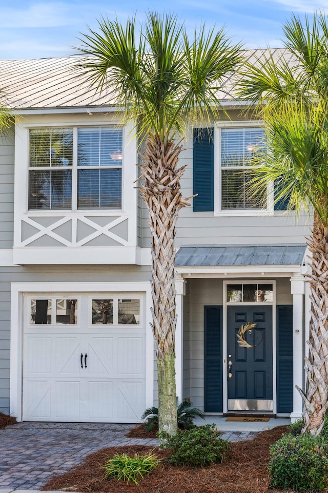 entrance to property featuring a garage