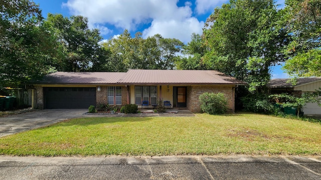 ranch-style home featuring a porch, a front lawn, and a garage