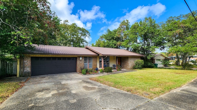 single story home with a front lawn and a garage