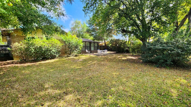 view of yard with a sunroom