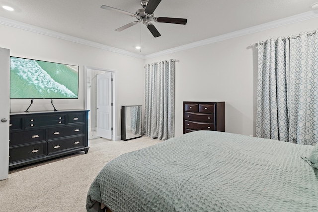 carpeted bedroom with ceiling fan and crown molding