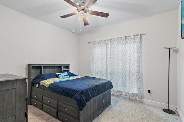 bedroom featuring light carpet and ceiling fan