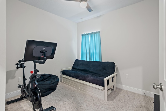 workout room featuring carpet flooring and ceiling fan