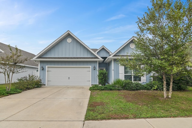 view of front of home with a garage and a front lawn