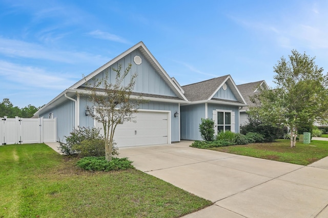 view of front of house with a front yard and a garage