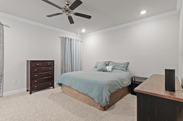 carpeted bedroom with ceiling fan and ornamental molding