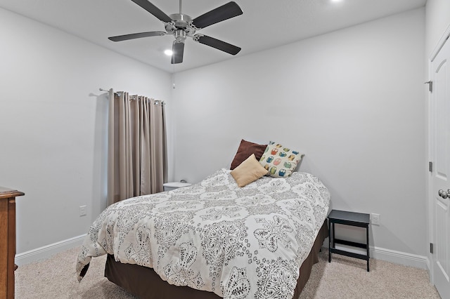 bedroom featuring ceiling fan and light colored carpet