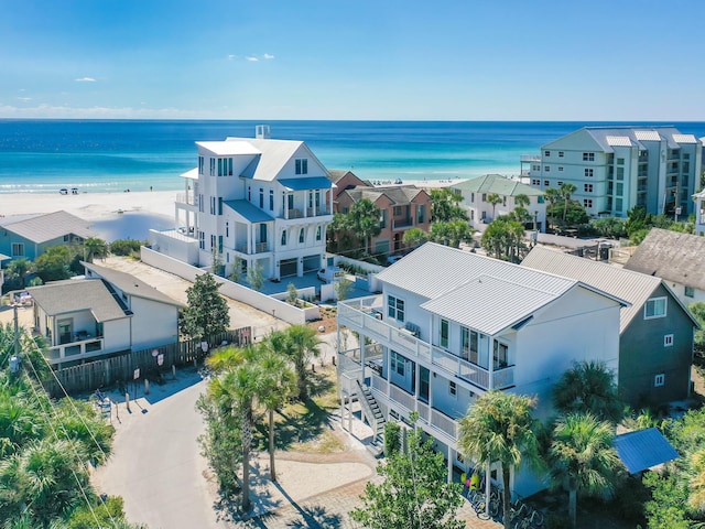 birds eye view of property featuring a water view and a view of the beach