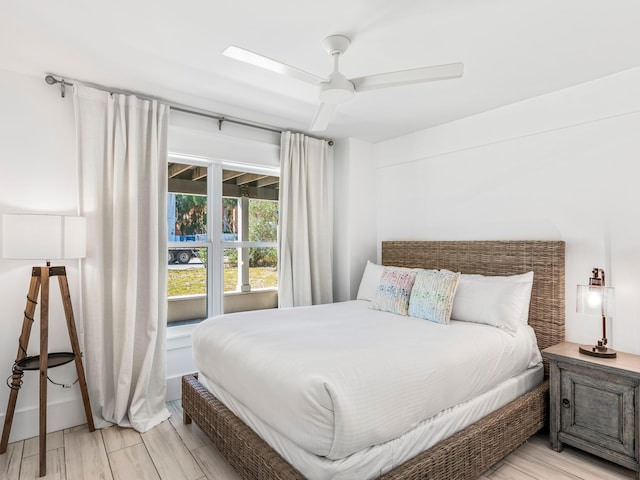 bedroom featuring light hardwood / wood-style floors and ceiling fan