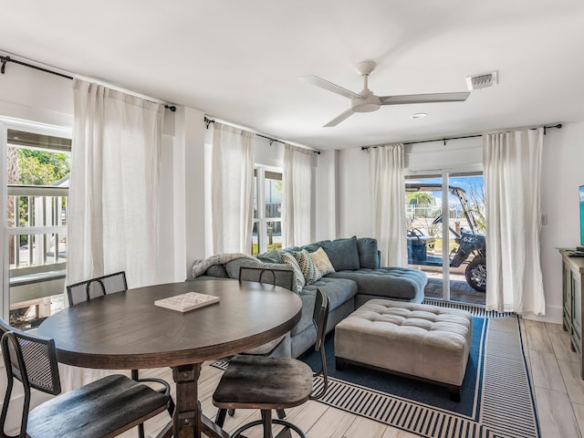 dining area featuring light hardwood / wood-style floors, a healthy amount of sunlight, and ceiling fan