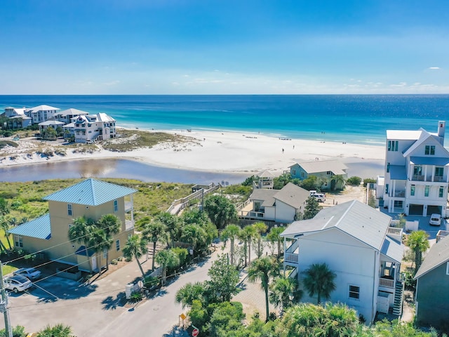 aerial view featuring a water view and a beach view