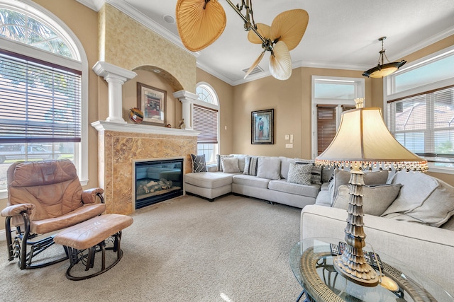 4705 Seastar Vis, Destin, FL 32541 - carpeted living room with a fireplace, plenty of natural light, and ornamental molding