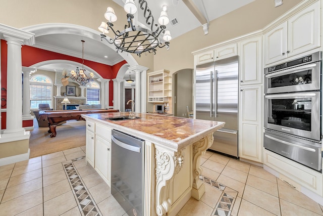 4705 Seastar Vis, Destin, FL 32541 - kitchen with ornate columns, appliances with stainless steel finishes, a sink, and a warming drawer