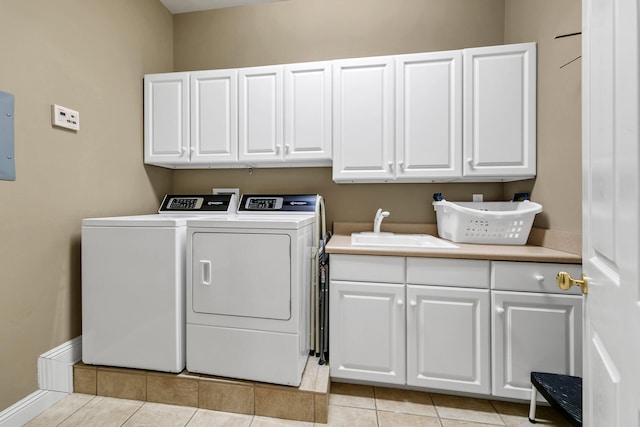 4705 Seastar Vis, Destin, FL 32541 - clothes washing area with a sink, cabinet space, light tile patterned floors, and washer and dryer