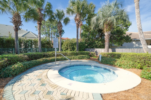 view of pool with a patio area and a community hot tub