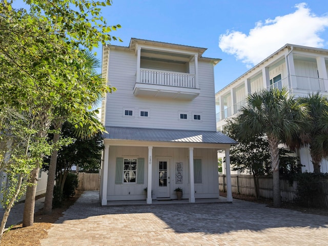 view of front facade with a balcony and a porch