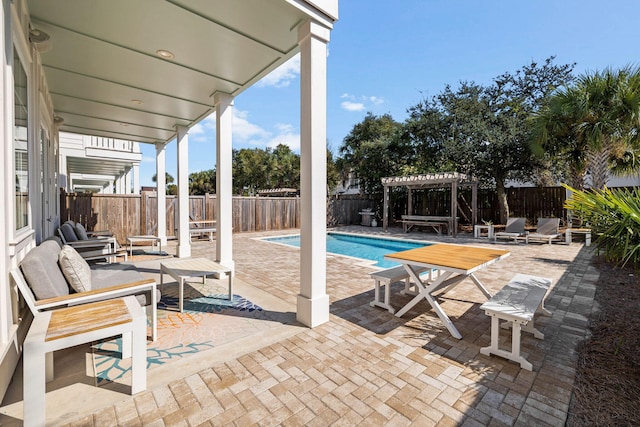 view of swimming pool with a patio and a pergola