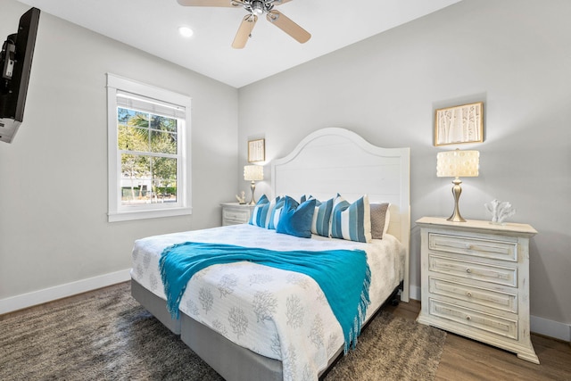 bedroom with dark wood-type flooring and ceiling fan