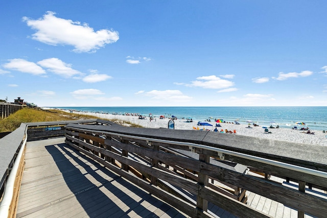 exterior space featuring a water view and a view of the beach