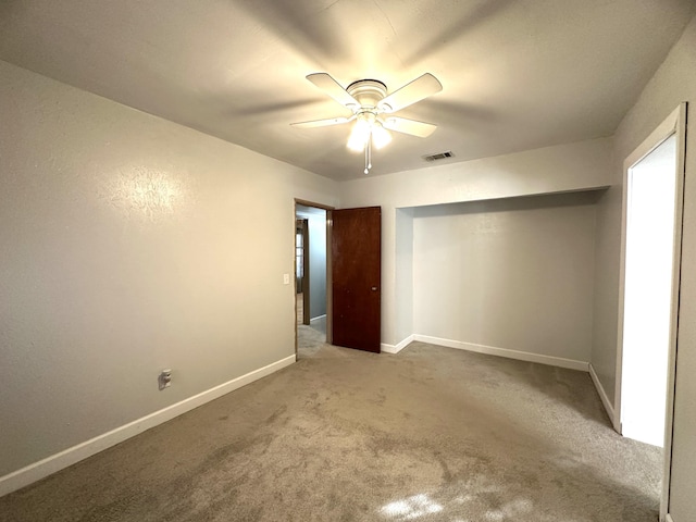 unfurnished bedroom featuring carpet flooring and ceiling fan