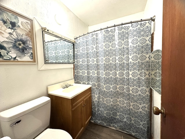 bathroom featuring hardwood / wood-style floors, vanity, and toilet