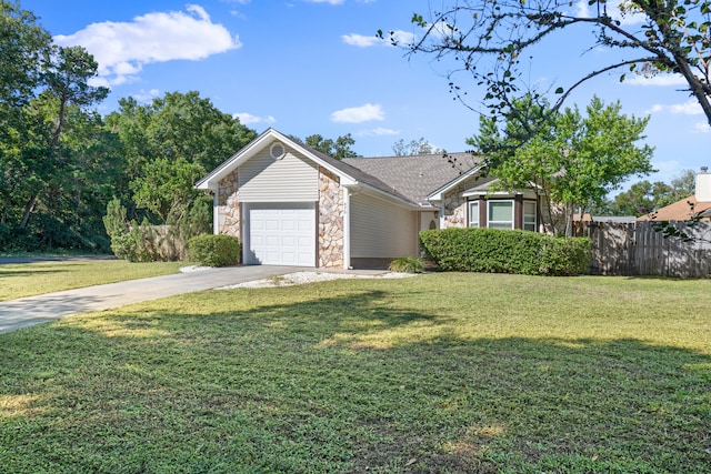 view of front of house with a front lawn and a garage