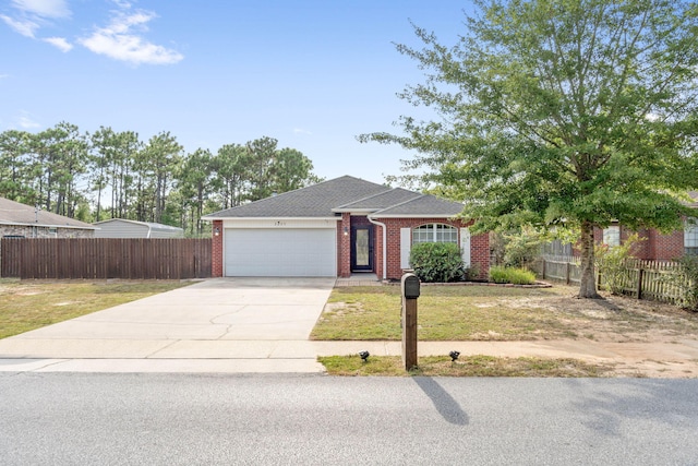 single story home with a front yard and a garage