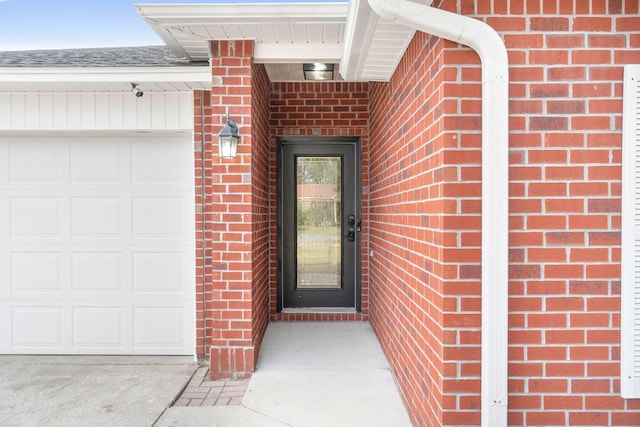 entrance to property featuring a garage