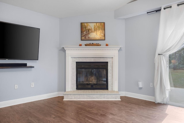 unfurnished living room with wood-type flooring