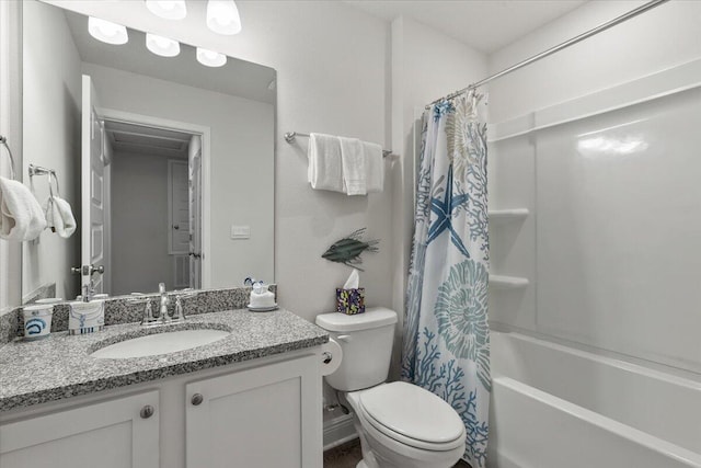 full bathroom with toilet, vanity, and shower / bath combo with shower curtain