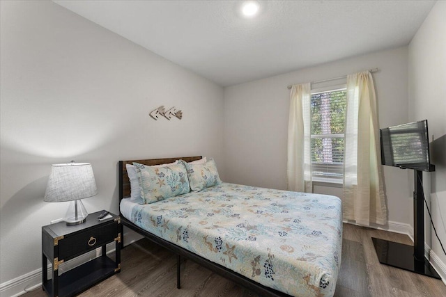 bedroom featuring hardwood / wood-style flooring