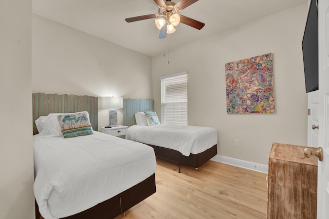 bedroom featuring hardwood / wood-style flooring and ceiling fan