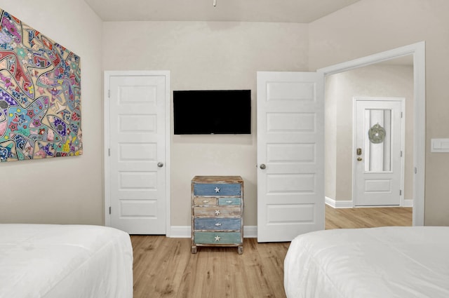 bedroom with light wood-type flooring