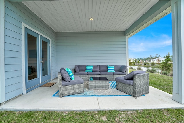 view of patio / terrace featuring outdoor lounge area and a water view