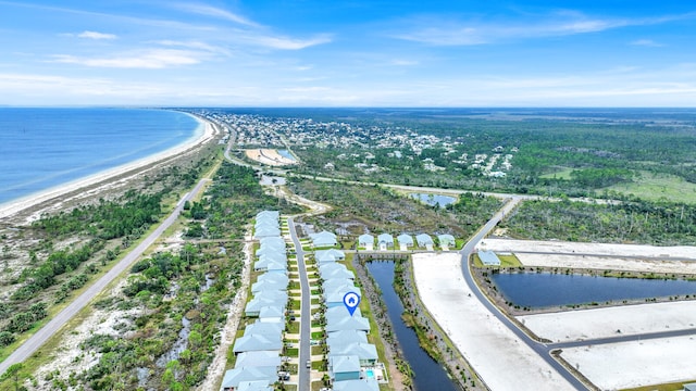 drone / aerial view with a beach view and a water view