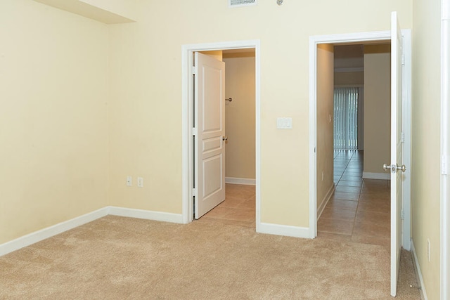 interior space featuring light colored carpet