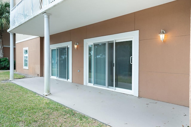 exterior space featuring a patio and a lawn