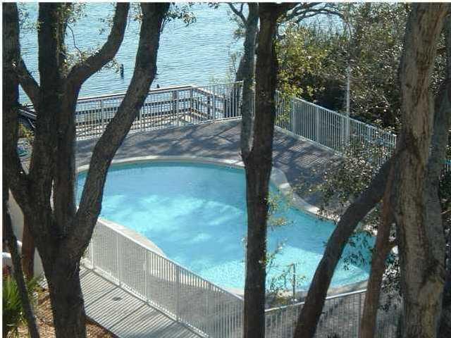 view of swimming pool with a water view