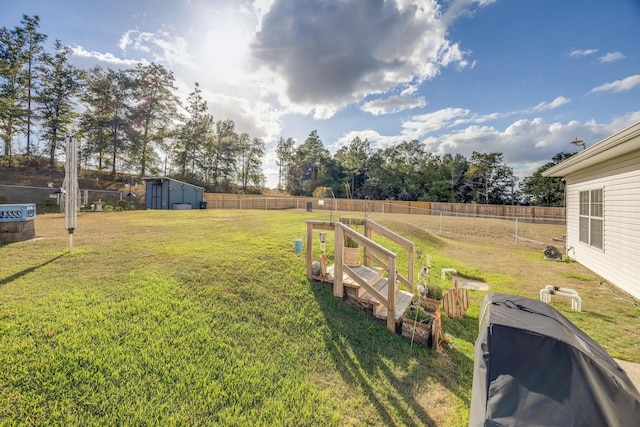 view of yard with a storage shed