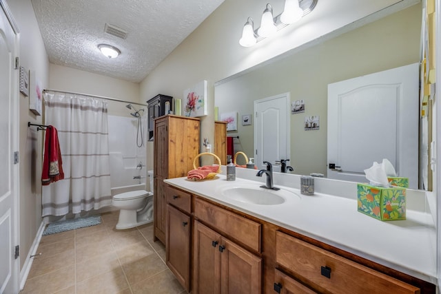 full bathroom with a textured ceiling, shower / bath combination with curtain, toilet, vanity, and tile patterned flooring