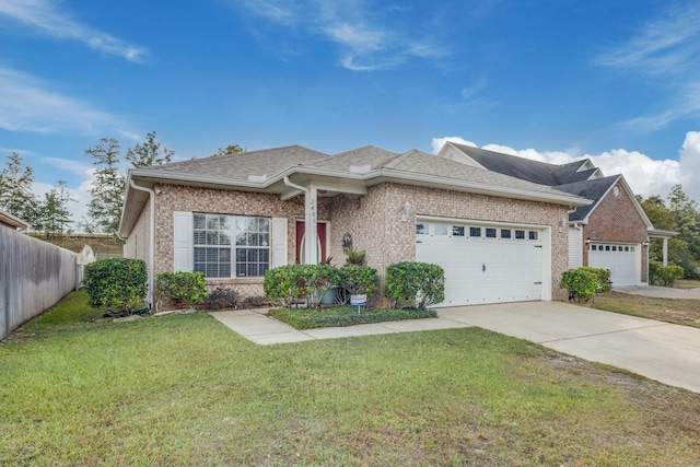 view of front of property with a front yard and a garage