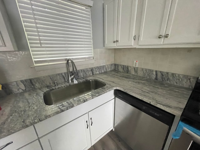 kitchen with sink, dishwasher, dark hardwood / wood-style flooring, white cabinets, and light stone counters