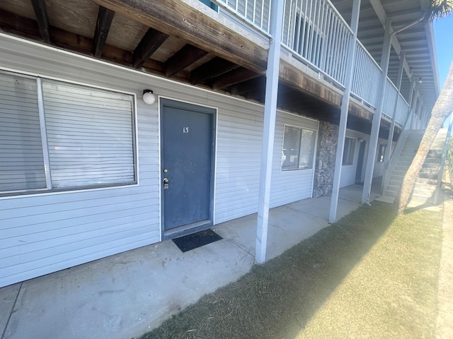 entrance to property featuring a patio