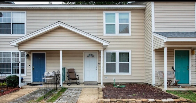 townhome / multi-family property with covered porch