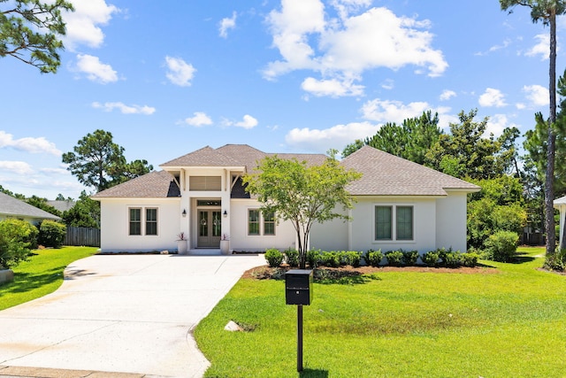 mediterranean / spanish-style home featuring a front yard