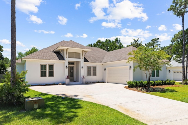 view of front facade with a front yard and a garage