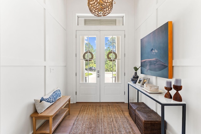 foyer entrance featuring french doors and hardwood / wood-style flooring