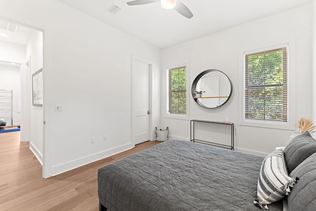 bedroom featuring light hardwood / wood-style flooring and ceiling fan